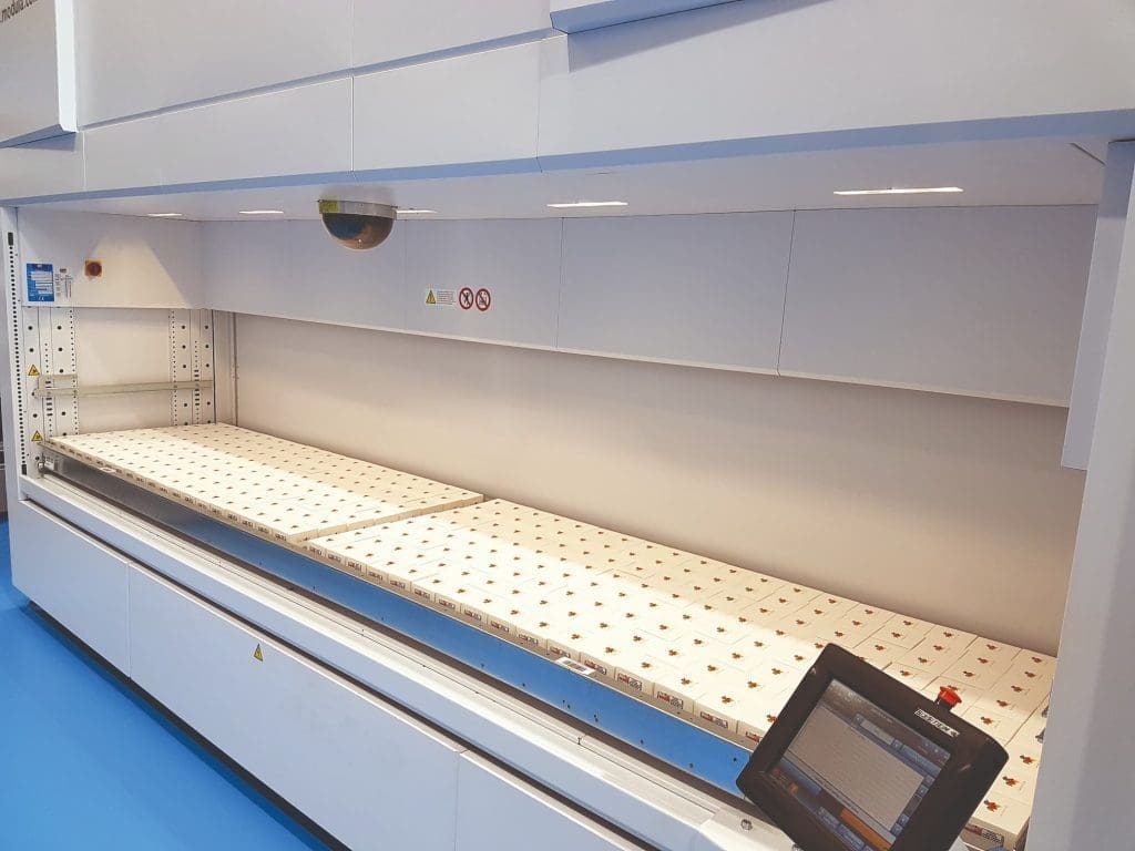 Internal tray storage system inside vertical lift module